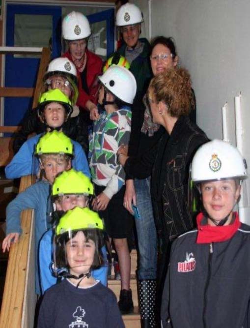 Pictured above: Children enjoy a visit to the Pacific Helmet factory. Image